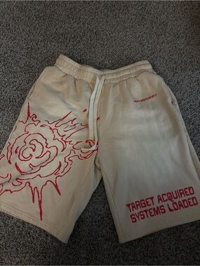 Beige Athletic Shorts with Red Graphic Print